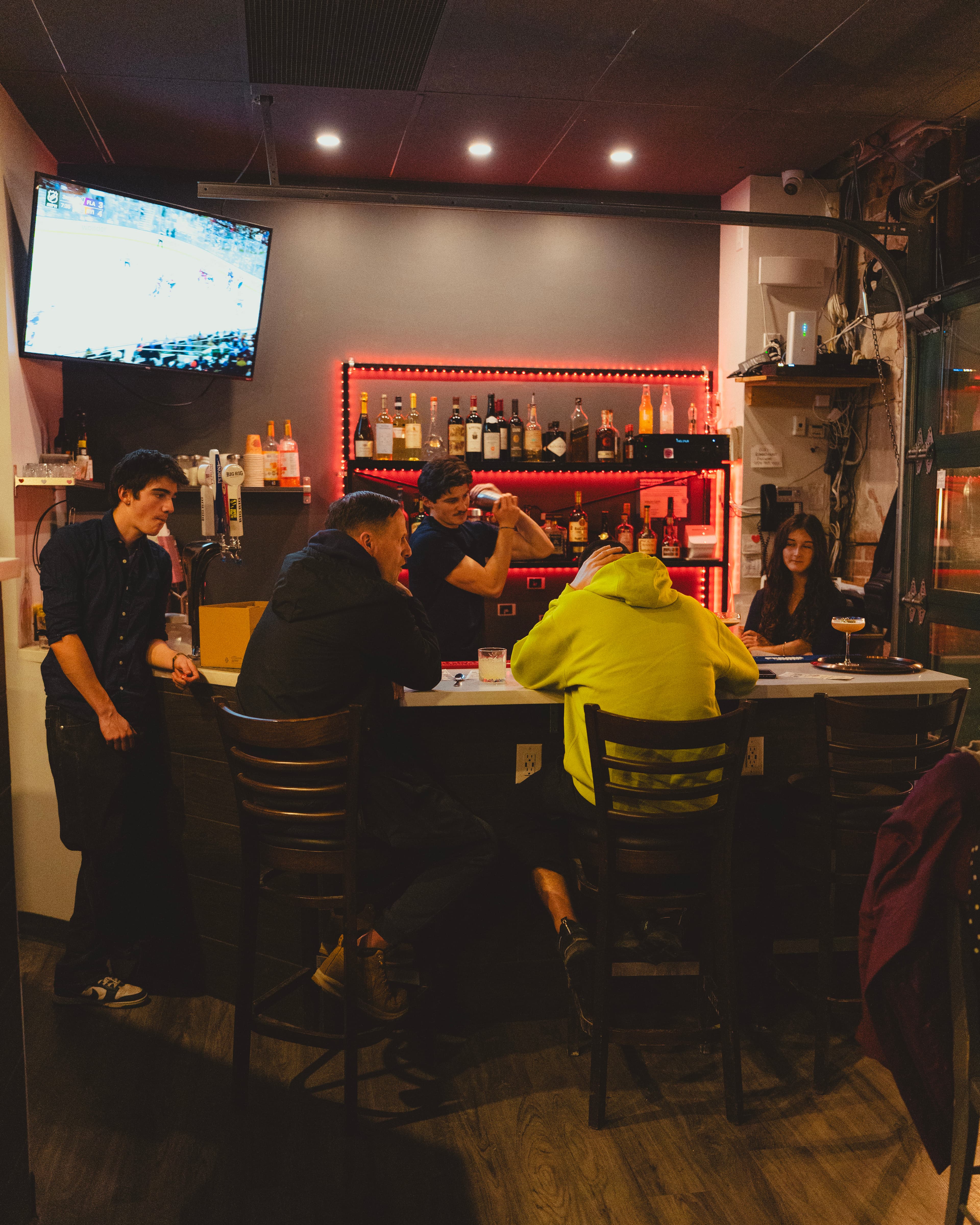 Guests gathered around a bar during a Prosper Events evening